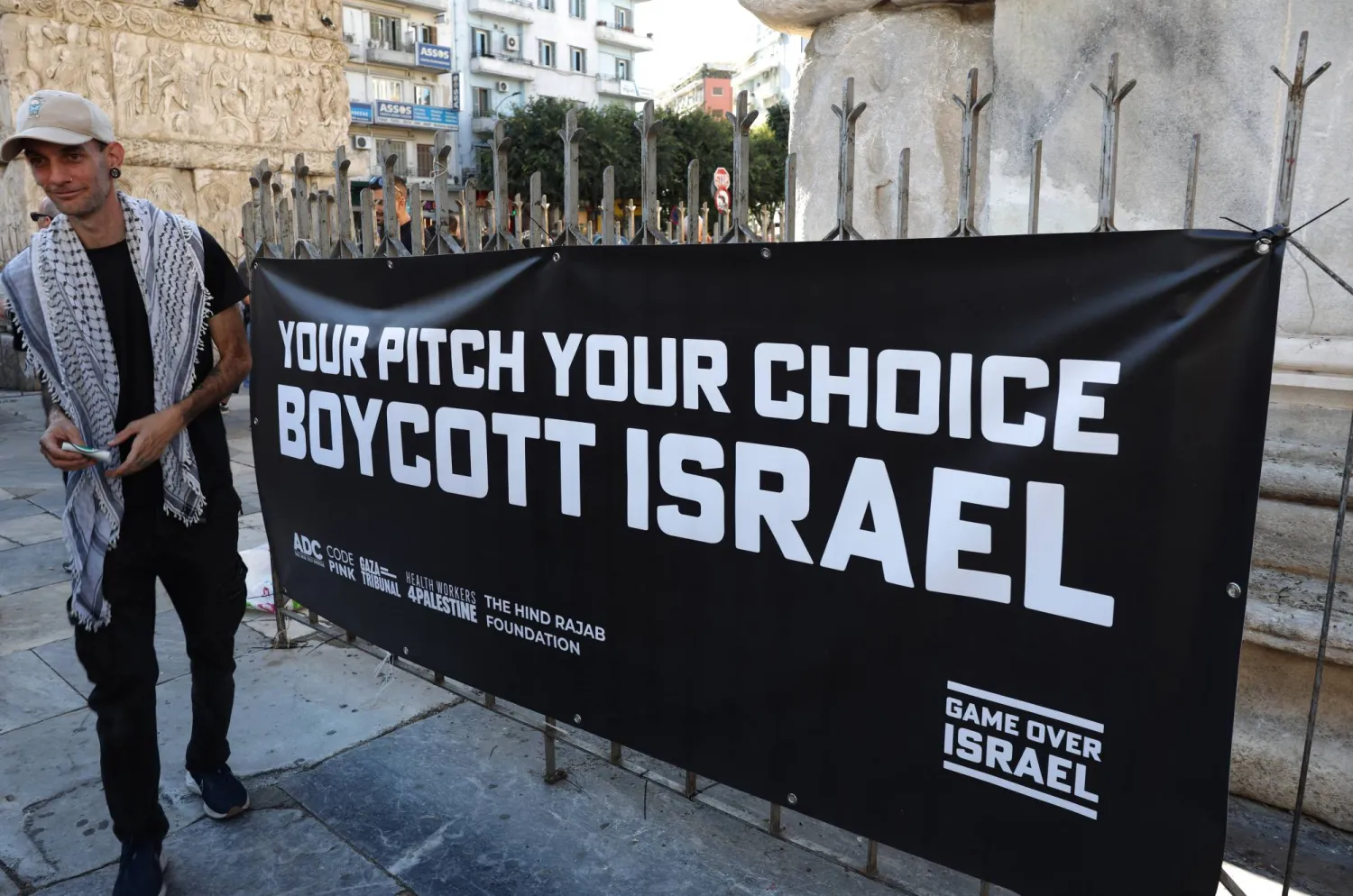 Soccer Football - UEFA Europa League - PAOK fans gather in the city center to protest against Maccabi Tel Aviv - Thessaloniki, Greece - September 24, 2025  A sign is displayed during the protest reading "your pitch your choice boycott Israel" REUTERS/Murad Sezer
