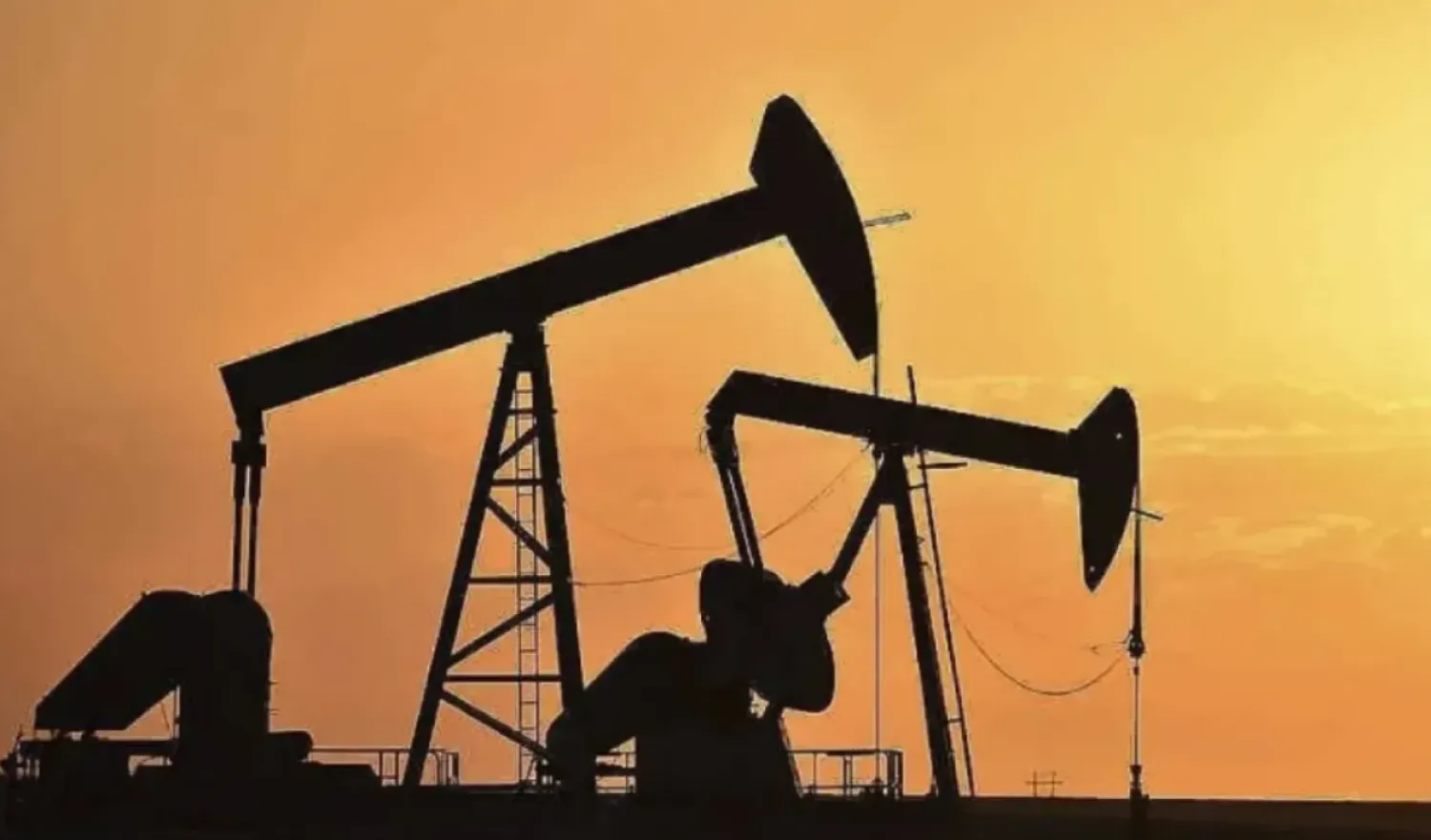 FILE - Pump jacks extract oil from beneath the ground in North Dakota, May 19, 2021. (AP Photo/Matthew Brown, File)