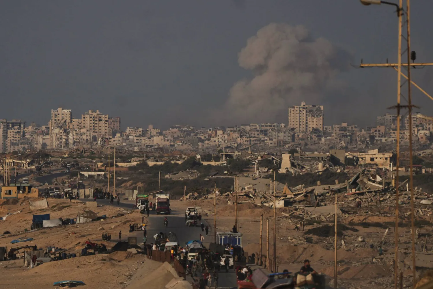 Smoke rises following an Israeli military strike in Gaza City, as seen from the central Gaza Strip, Friday, Sept. 26, 2025. (AP Photo/Abdel Kareem Hana)