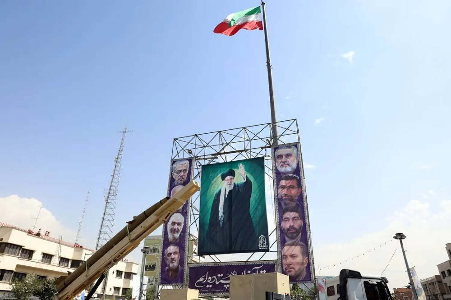 An Iranian Kheibar-Shekan medium-range ballistic missile (MRBM) placed next to a large banner depicting Iranian supreme leader Ali Khamenei (C) in Baharestan Square in Tehran, Iran, 27 September 2025. (EPA)