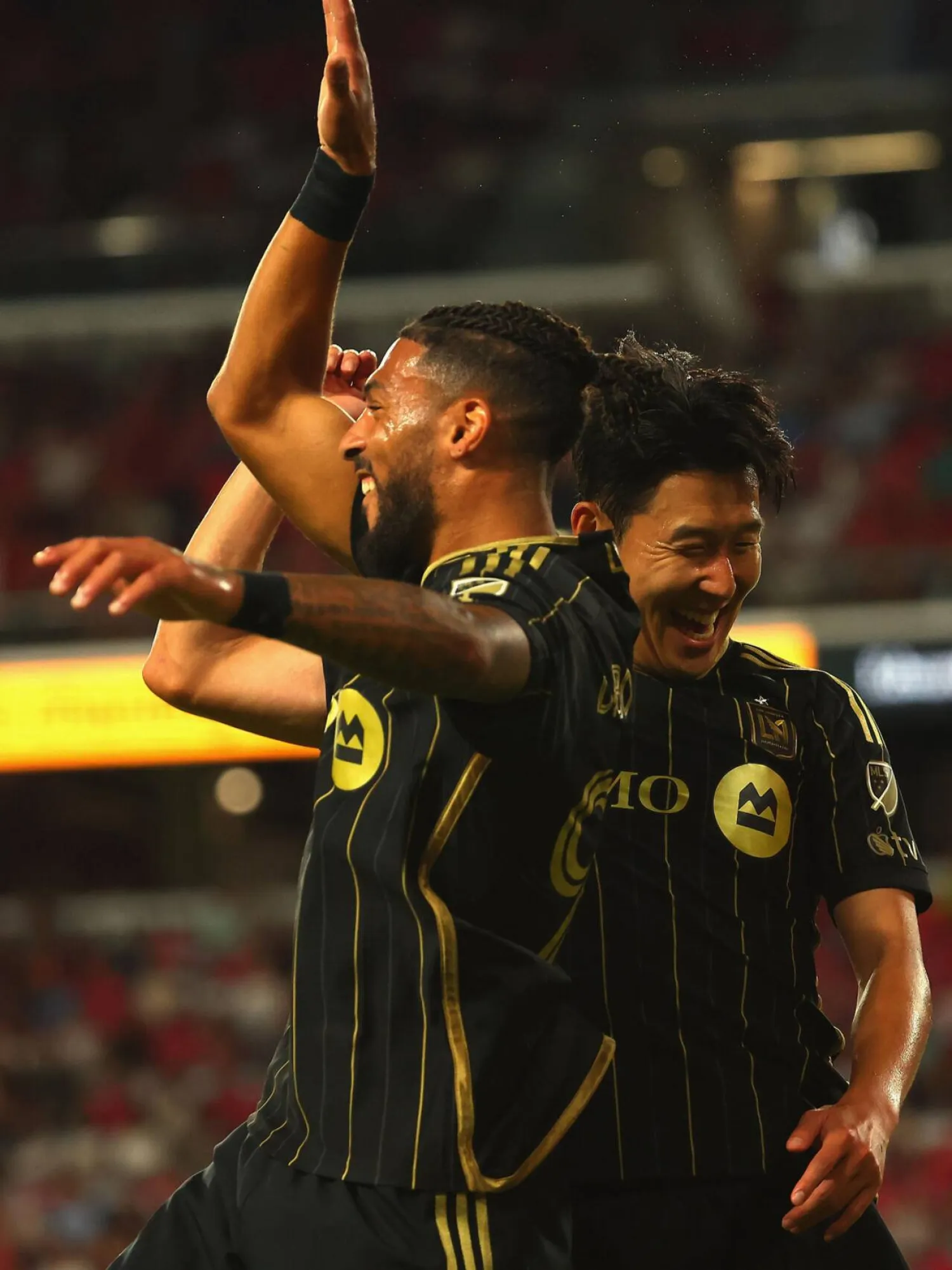Denis Bouanga celebrates with Los Angeles FC teammate Son Heung-min after scoring in a 3-0 MLS victory over St. Louis City. Dilip Vishwanat / GETTY IMAGES NORTH AMERICA/AFP
