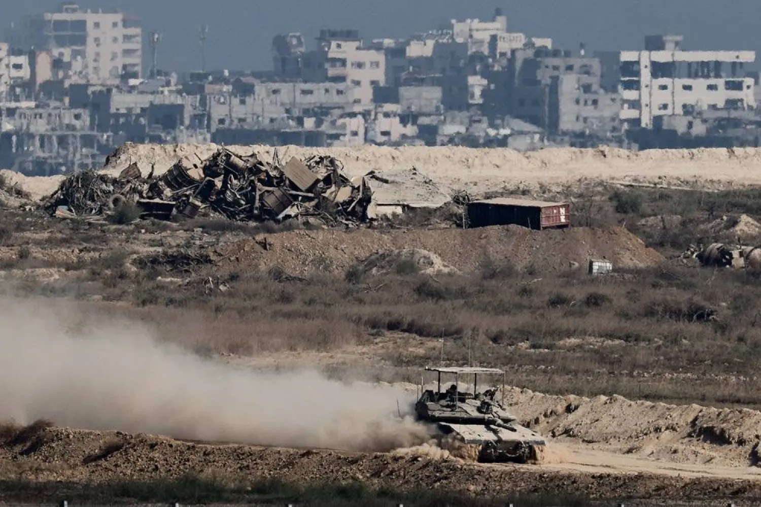  An Israeli tank maneuvers in Gaza, as seen from the Israeli side of the border, September 28, 2025. (Reuters)