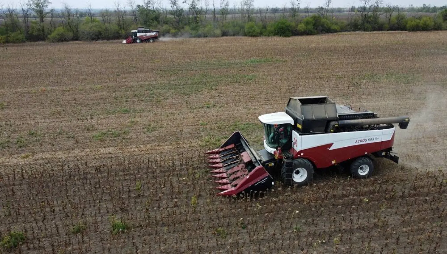 A drone view shows combines harvesting sunflowers in a field in the Rostov Region, Russia September 3, 2025. (Reuters)