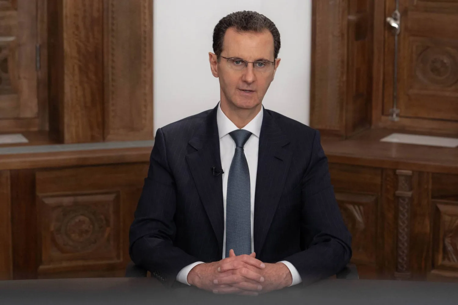 16 February 2023, Syria, Damascus: A photo released by the official Syrian Arab news agency (SANA) on 16 February shows then Syrian President Bashar al-Assad delivering a televised speech. (SANA/dpa)