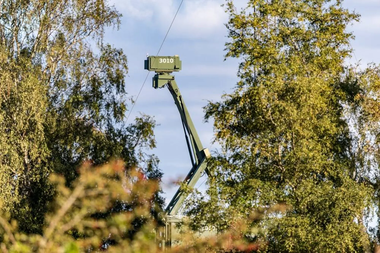 A mobile radar installation stands at the Danish military's area on Amager, Pionegaarden, near the village of Dragoer and on the coast of Oresund, the sea between Denmark and Sweden, in Dragoer, Denmark, 26 September 2025. (EPA)