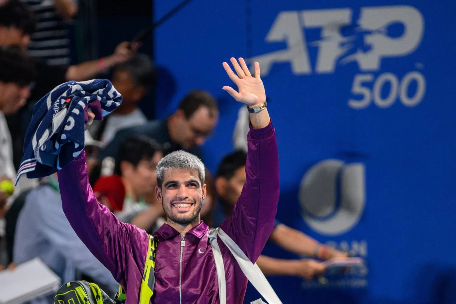 Spain's Carlos Alcaraz reacts after his men's singles match against USA's Brandon Nakashima at the ATP Japan Open tennis tournament in Tokyo on September 28, 2025. (Photo by Philip FONG / AFP)