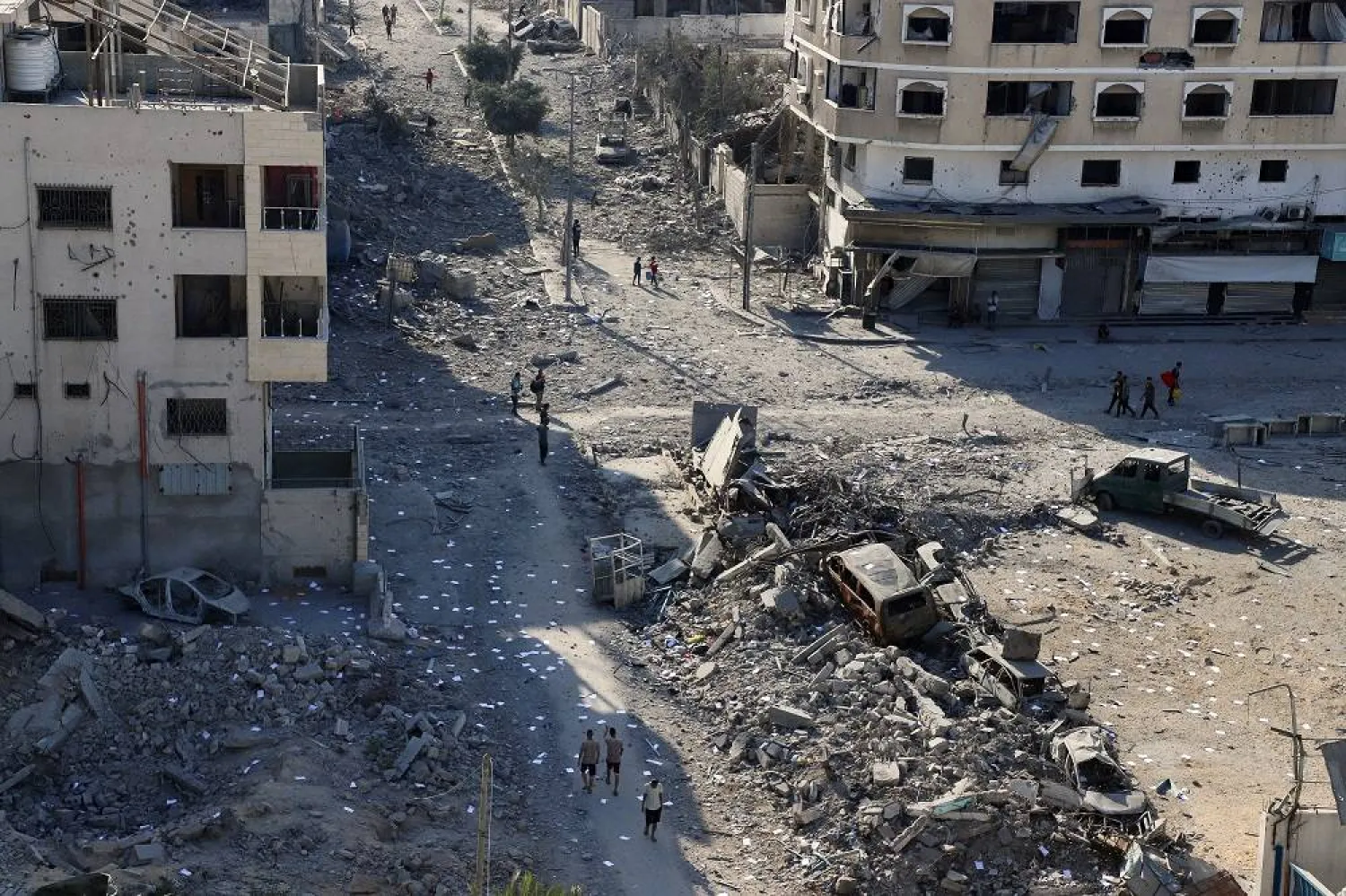 Palestinians inspect the damage following an Israeli raid, amid an Israeli military operation, in Gaza City, September 29, 2025. (Reuters)