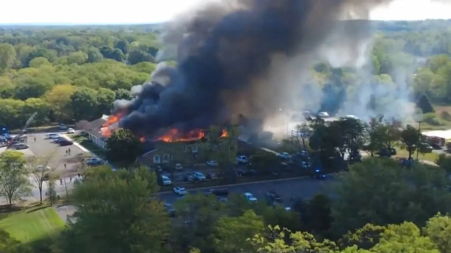 This frame grab from drone footage obtained from "X/Julie J/@MALKOWSKI6APRIL" shows a fire at a Church of Jesus Christ of Latter-day Saints in Grand Blanc Township, Michigan on September 28, 2025. (Photo by HANDOUT / X/Julie J/@MALKOWSKI6APRIL / AFP)