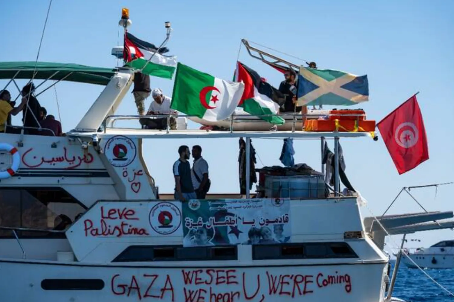 Members of the group of ships of the Global Sumud Flotilla to Gaza are seen moored at the small island of Koufonisi, Greece - AFP
