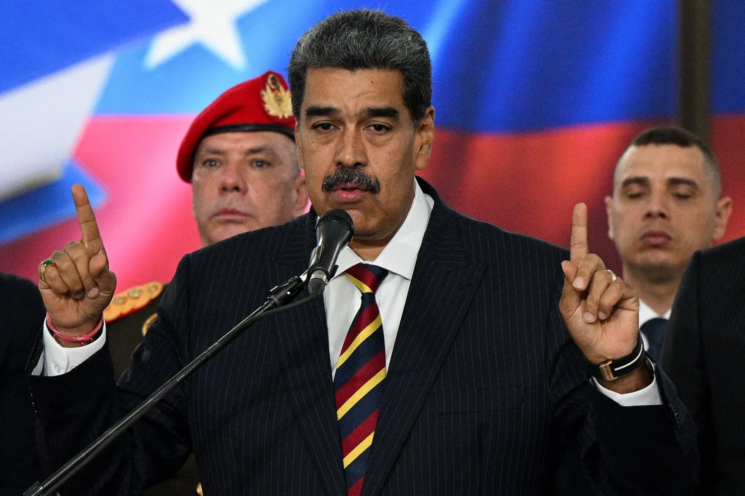 (FILES) Venezuela's President Nicolas Maduro (C) addresses the media after appearing before the Supreme Court of Justice (TSJ) in Caracas on August 9, 2024. (Photo by Federico PARRA / AFP)