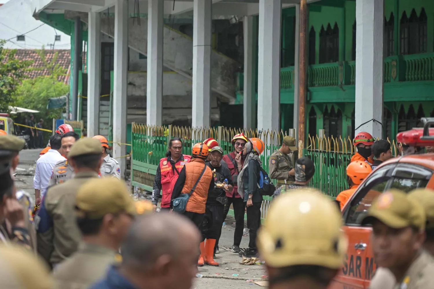 Rescue personnel work on the scene at the Al Khoziny Islamic boarding school in Sidoarjo, East Java province on September 30, 2025. (AFP) 