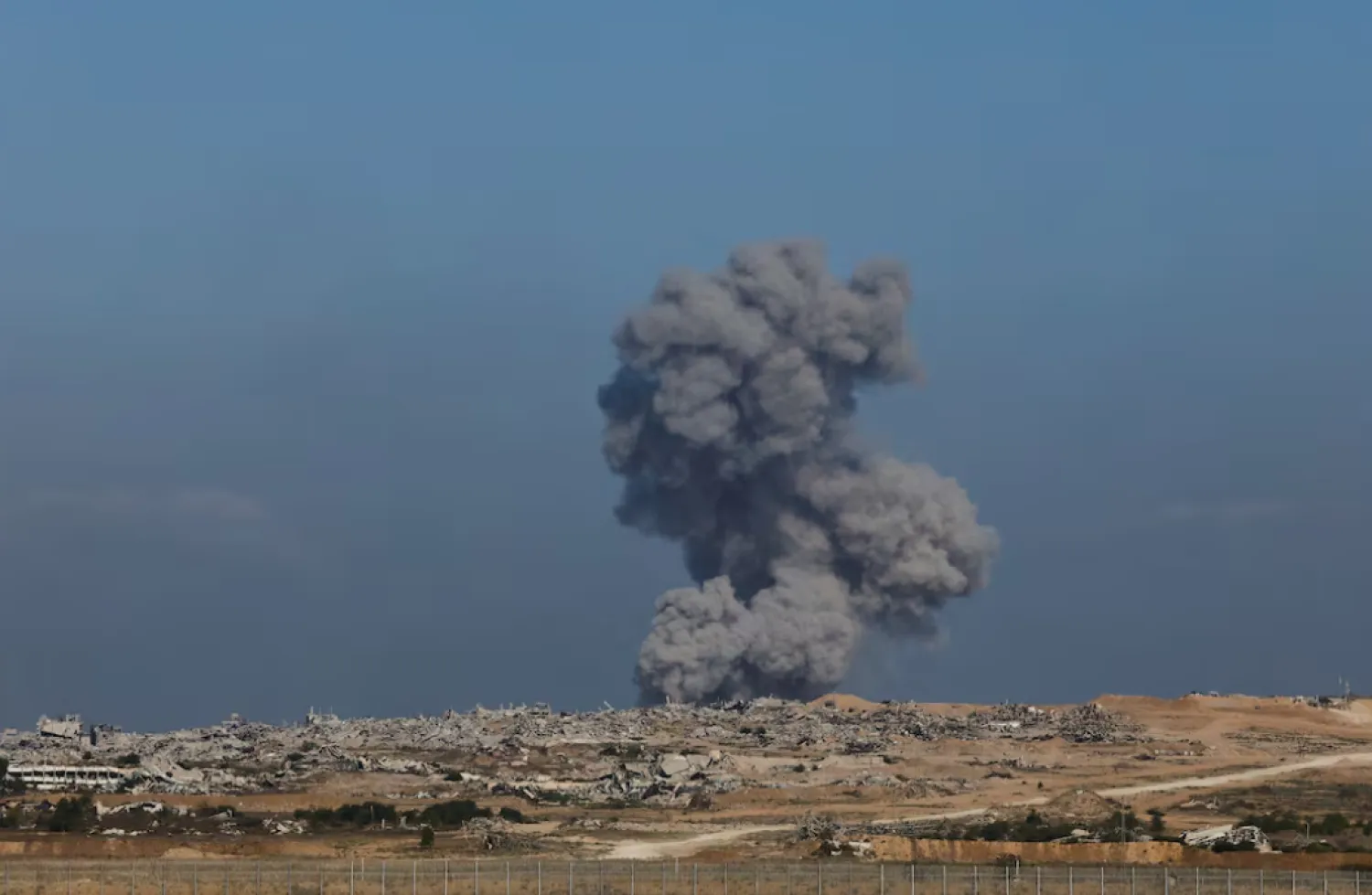 Smoke rises from Gaza after an explosion, as seen from the Israeli side of the border, September 30, 2025. REUTERS/Amir Cohen 