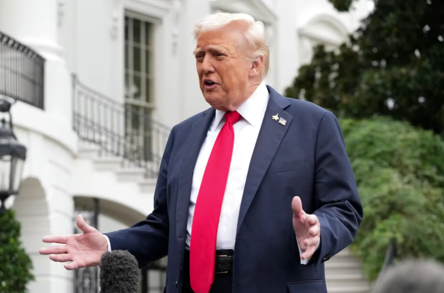 US President Donald Trump speaks to the press before boarding Marine One to depart for Quantico, Virginia, from the South Lawn at the White House in Washington, D.C., US, September 30, 2025. REUTERS/Ken Cedeno 