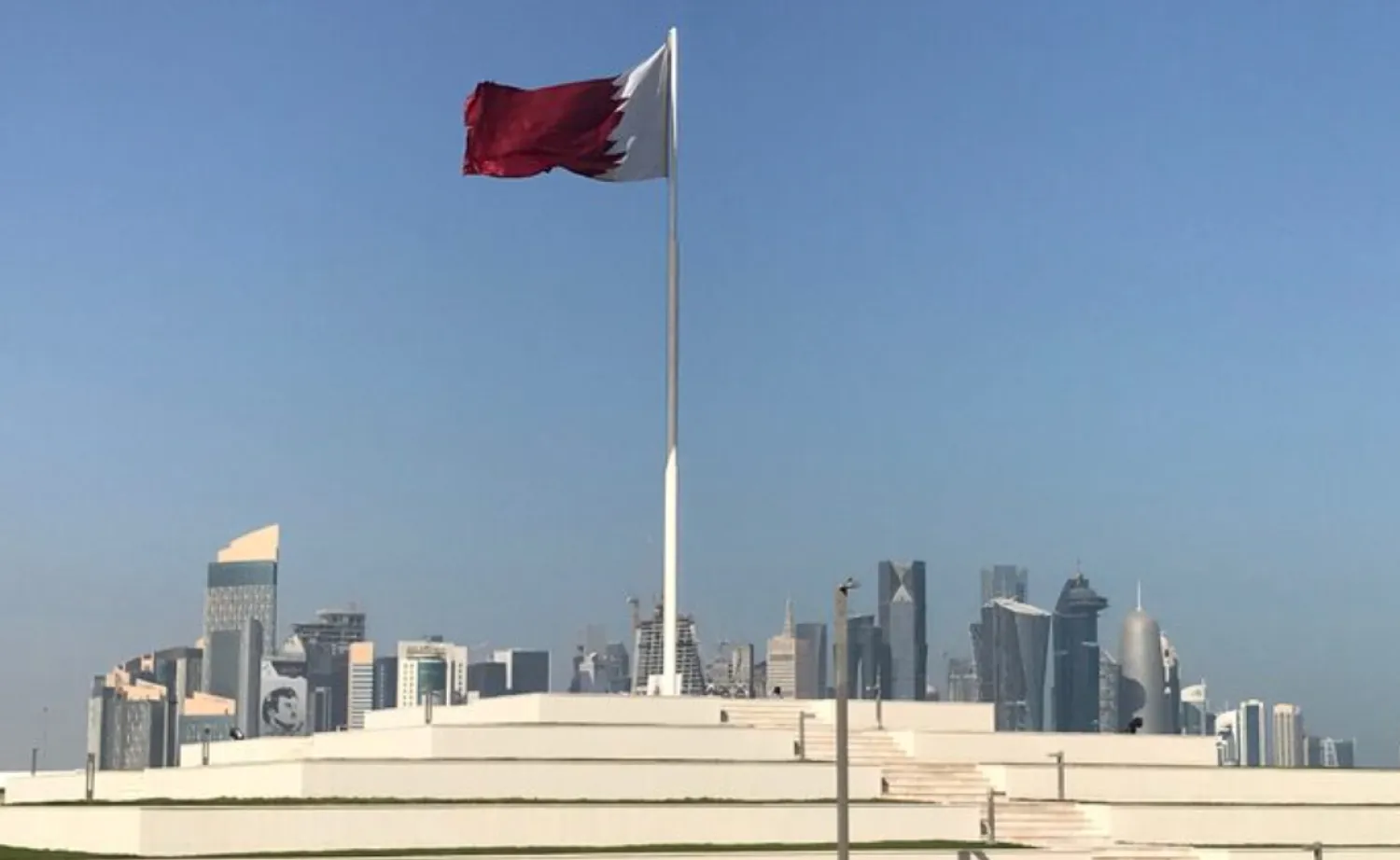 FILE PHOTO: The Qatari flag is seen at a park near Doha Corniche, in Doha, Qatar February 17, 2018. Picture taken February 17, 2018. REUTERS/Ibraheem al Omari/File Photo 