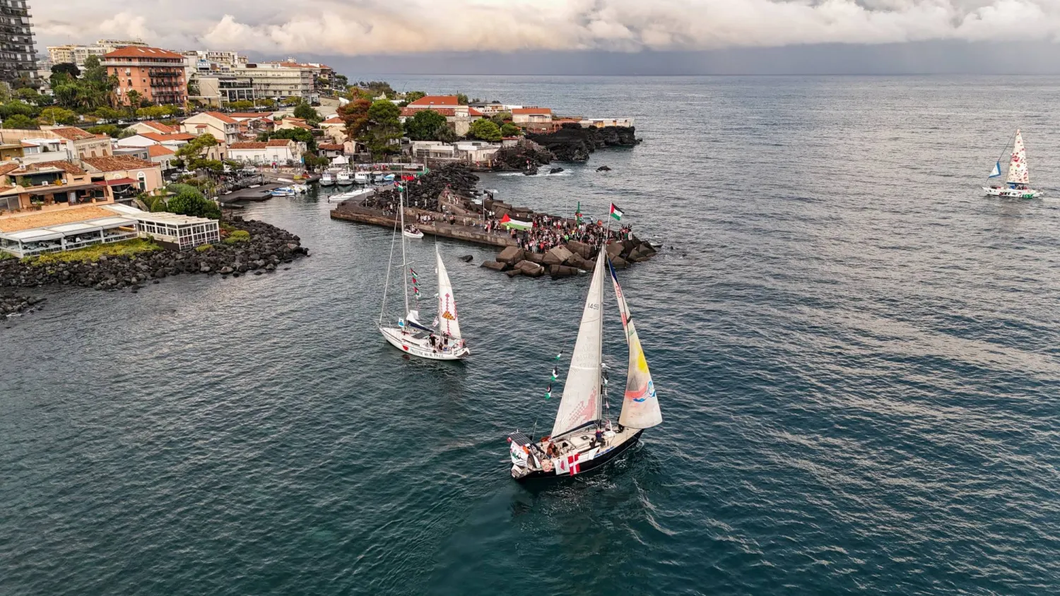A drone picture shows a flotilla of humanitarian boats led by French activist Melissa, dubbed the “Thousand Madleens,” departing from the Sicilian port of San Giovanni li Cuti in Catania, Italy September 27, 2025. (Reuters)