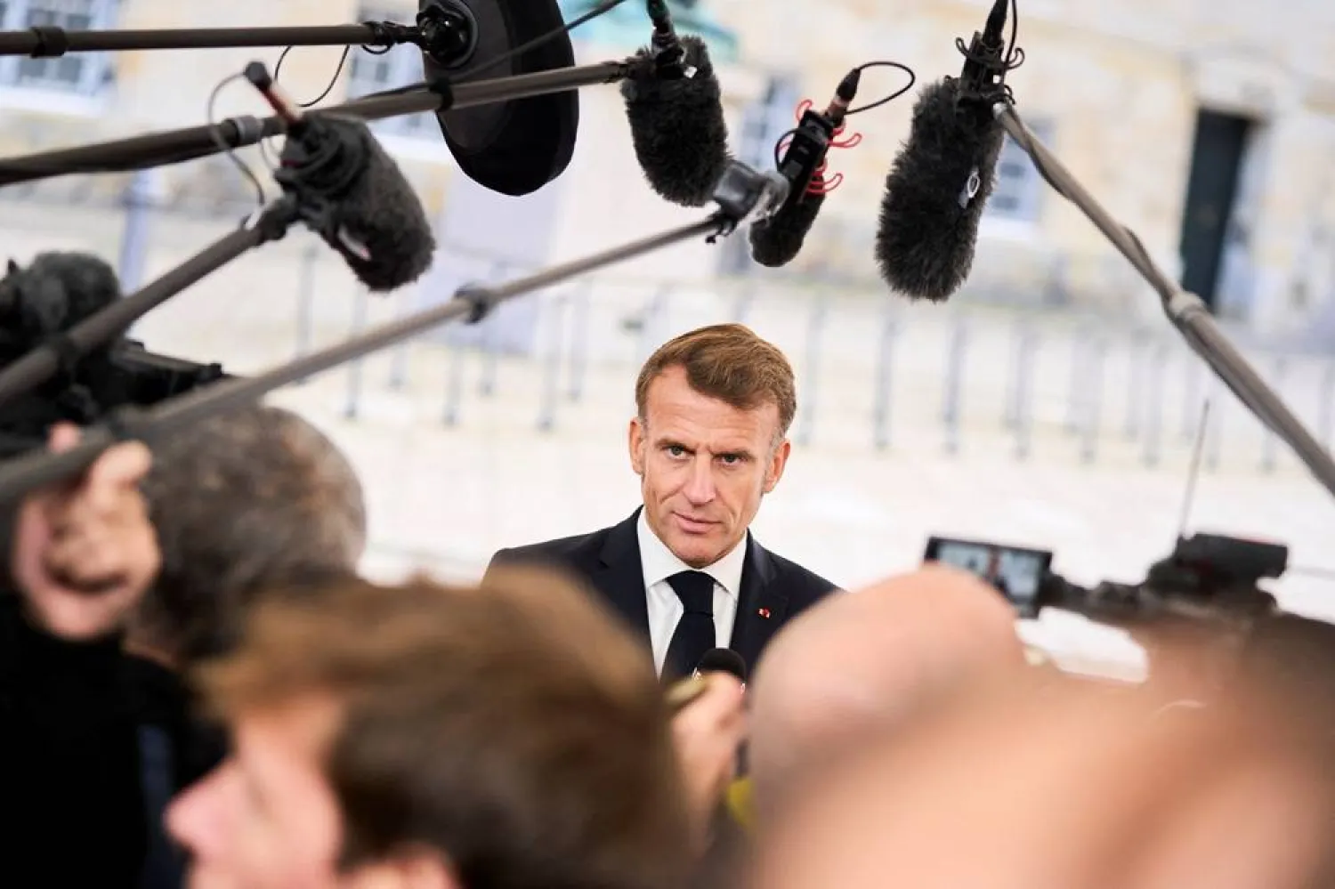 France's President Emmanuel Macron speaks to members of the media, during arrival for an informal summit at the Danish Parliament at Christiansborg Castle in Copenhagen, Denmark, October 1, 2025. (Ritzau Scanpix/Thomas Traasdahl via Reuters)