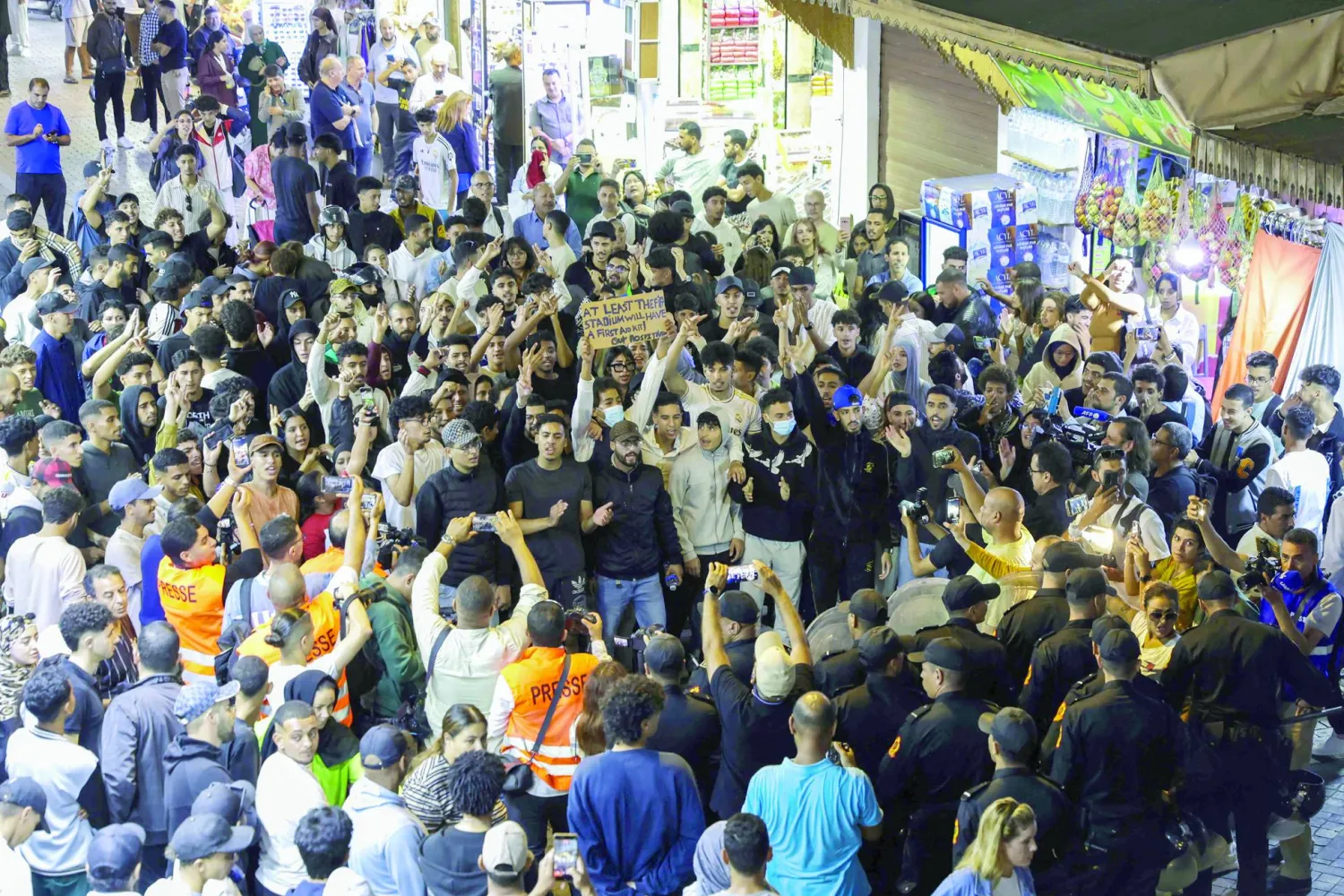 Protesters shout slogans during a youth-led demonstration in a market area in Rabat on September 29, 2025, calling for reforms in the public, health and education sectors.   (Photo by Abdel Majid BZIOUAT / AFP)