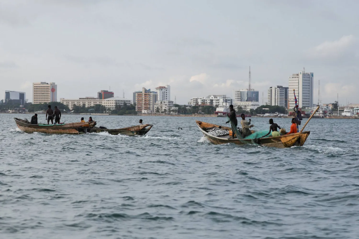 Fishermen return from a fishing trip along the Atlantic shoreline in Ibeju-Lekki, Lagos, Nigeria, June 13, 2025. REUTERS/Sodiq Adelakun