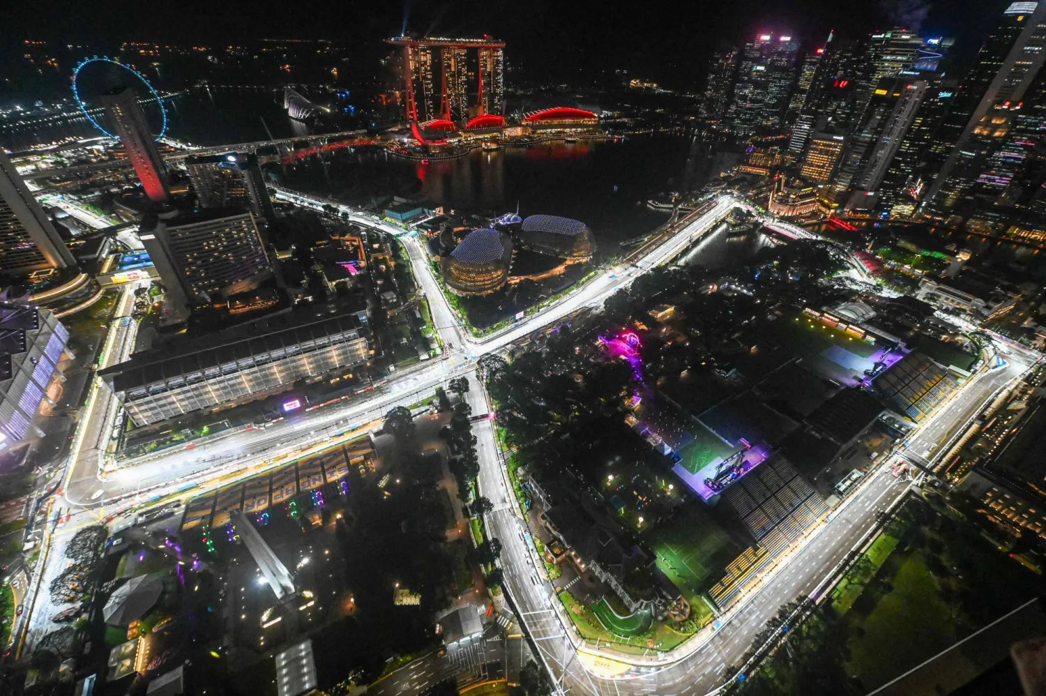 This photo shows the road circuit illuminated for the upcoming Formula One Singapore Grand Prix at the Marina Bay Street Circuit in Singapore on October 1, 2025. (Photo by Roslan RAHMAN / AFP)