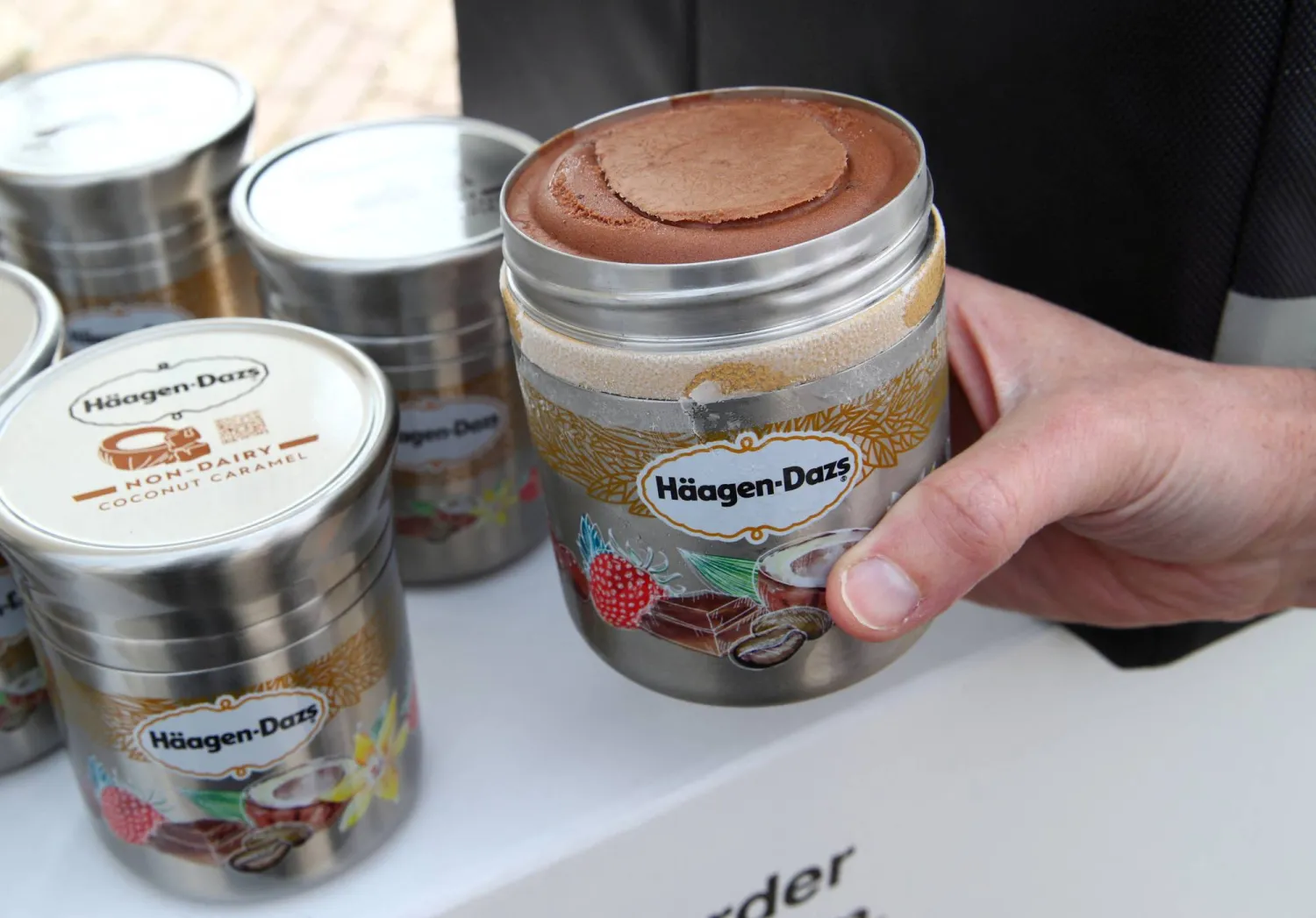 FILE PHOTO: A staff displays a reusable container of Haagen Dazs ice cream before the opening of the 152nd Annual General Meeting of Nestle in Lausanne, Switzerland April 11, 2019. REUTERS/Denis Balibouse/File Photo
