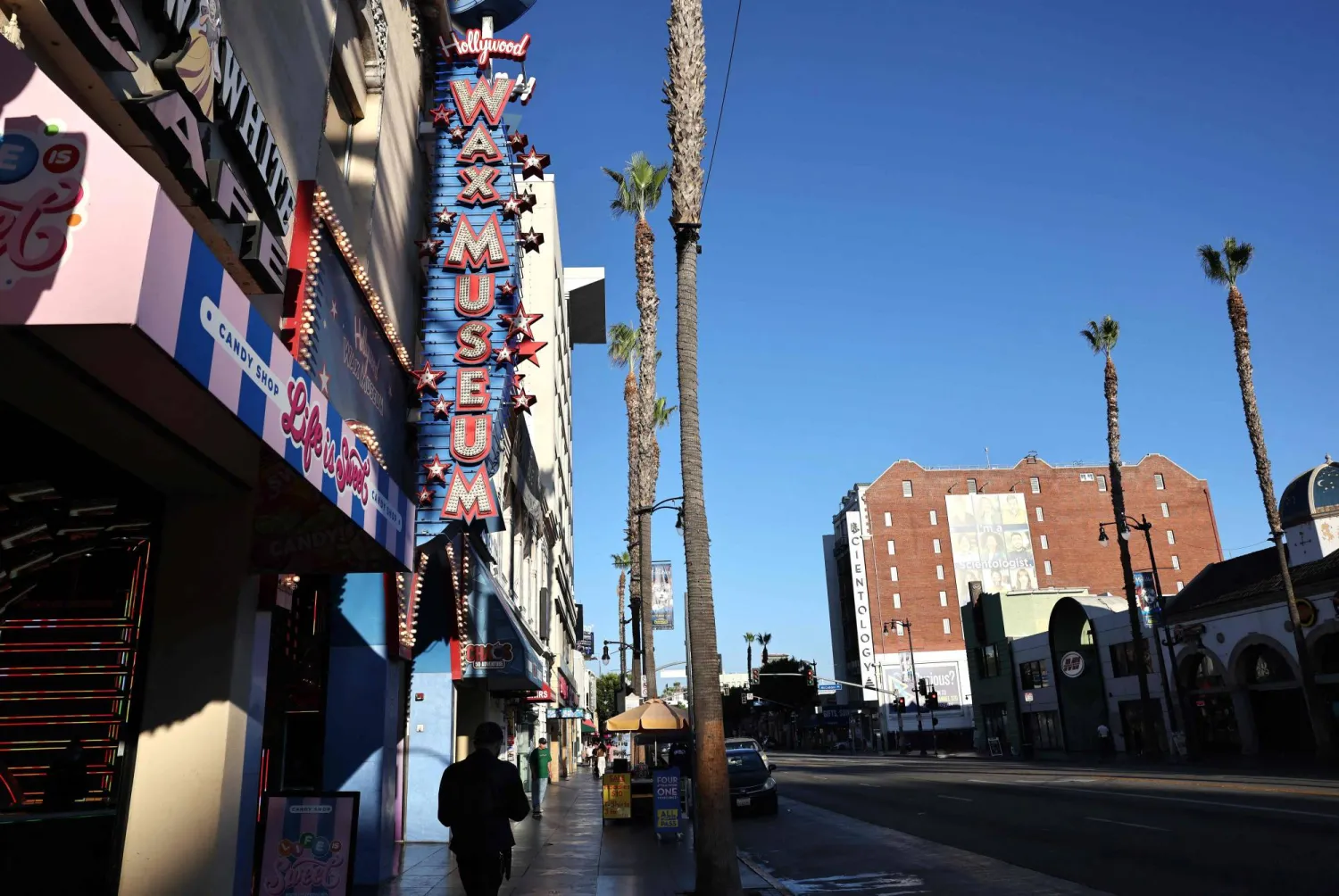 LOS ANGELES, CALIFORNIA - OCTOBER 01: People walk on Hollywood Boulevard on October 01, 2025 in Los Angeles, California. Mario Tama/Getty Images/AFP