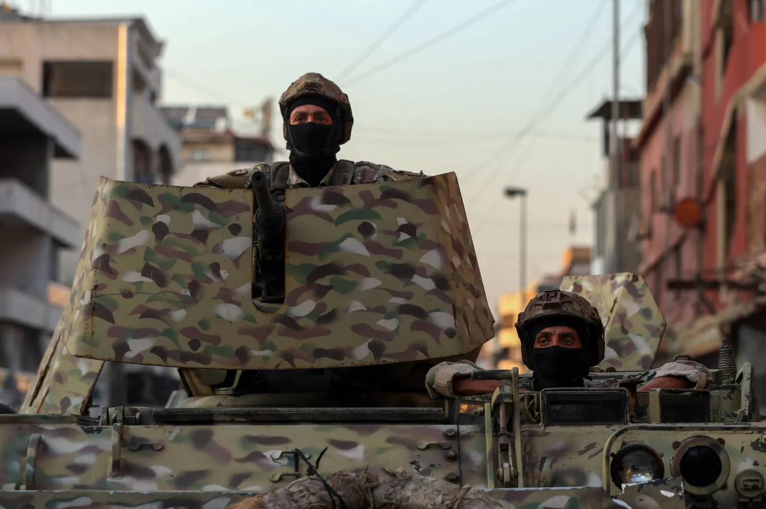 Lebanese soldiers sit on an armored personnel carrier at the entrance of Burj Barajneh Palestinian refugee camp in southern Beirut, Lebanon, 21 August 2025. EPA/WAEL HAMZEH