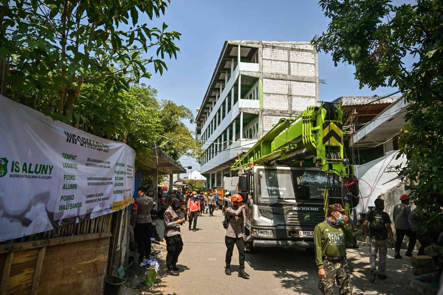 Personnel are seen as rescue operations continue at the site of a collapsed building at the Al Khoziny Islamic boarding school in Sidoarjo, East Java province, on October 3, 2025, after a multi-storey building at the school collapsed. (AFP)
