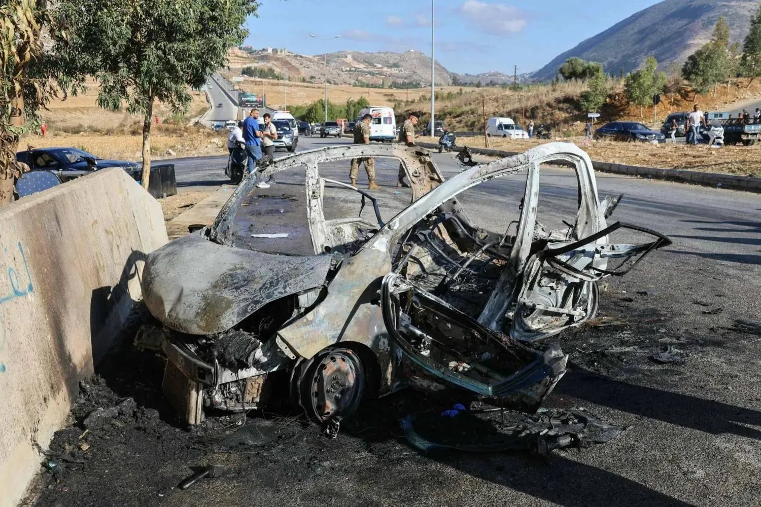 The vehicle targeted by an Israeli airstrike on the Jarmaq–Khardali road in southern Lebanon (AFP).  