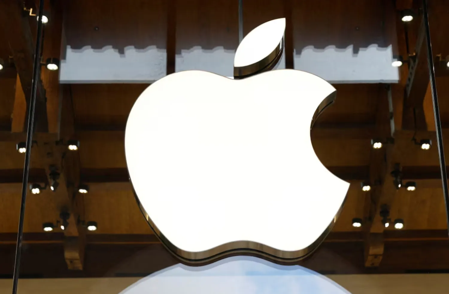View of an Apple logo at an Apple store in Paris, France, April 23, 2025. REUTERS/Abdul Saboor/File Photo 