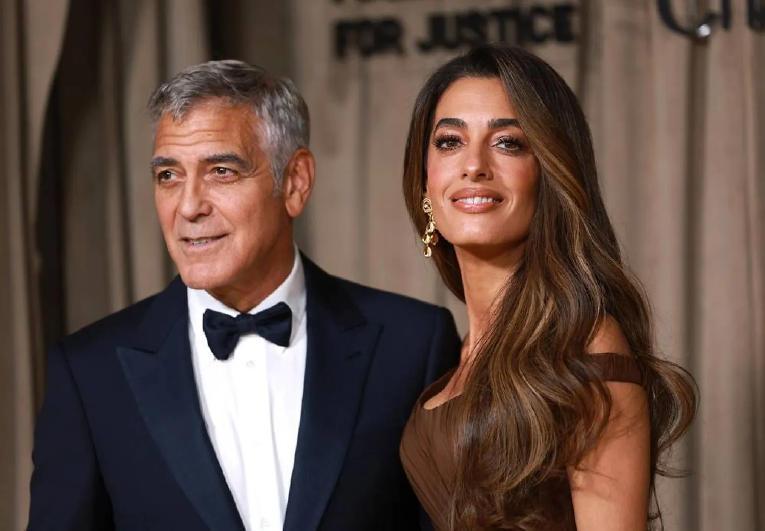 US actor George Clooney (L) and his wife, lawyer Amal Clooney (R) pose on the red carpet of The Albies Awards at the Natural History Museum in London, Britain, 03 October 2025. (EPA)