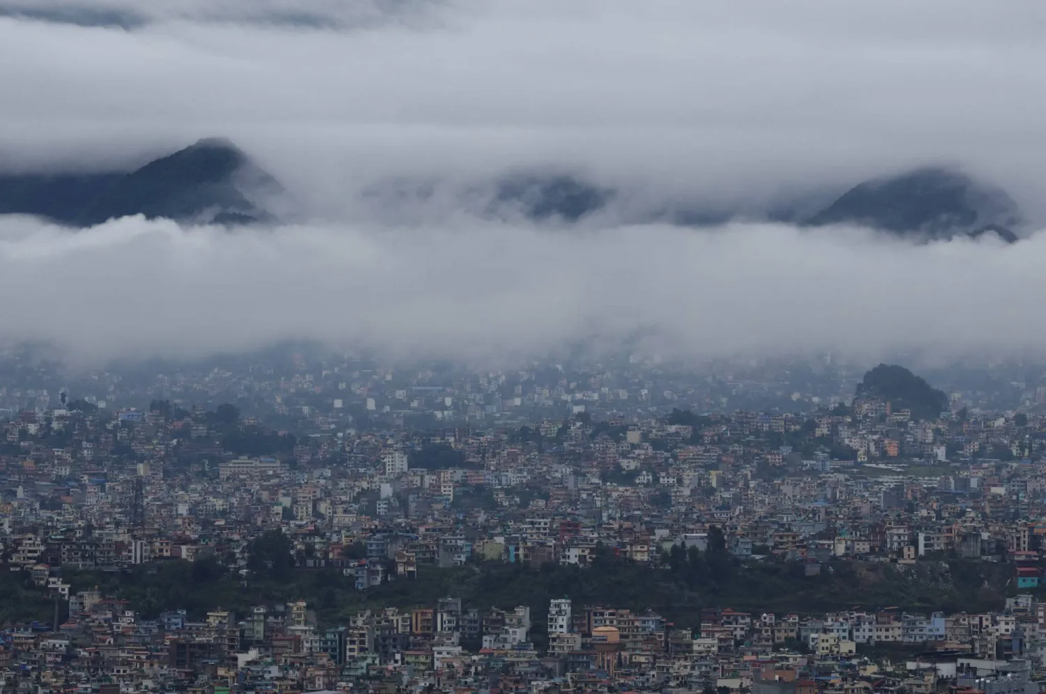 Monsoon clouds loom over the valley following heavy rainfall in Kathmandu, Nepal, October 5, 2025. REUTERS/Navesh Chitrakar