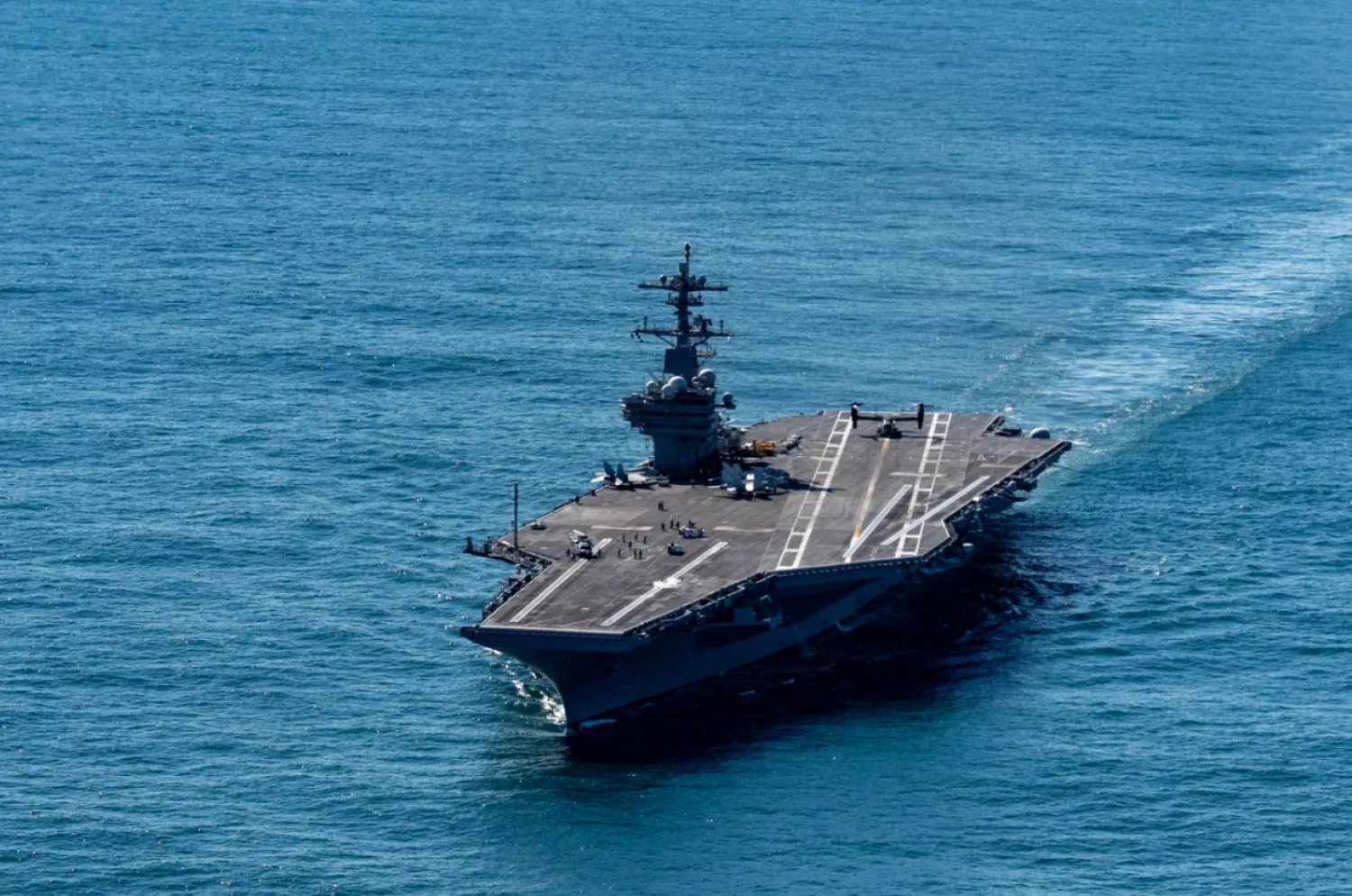 The USS George H.W. Bush aircraft carrier sails in the Atlantic Ocean off the coast of Norfolk, Va., Saturday, Oct. 4, 2025. (AP Photo/Alex Brandon, Pool)