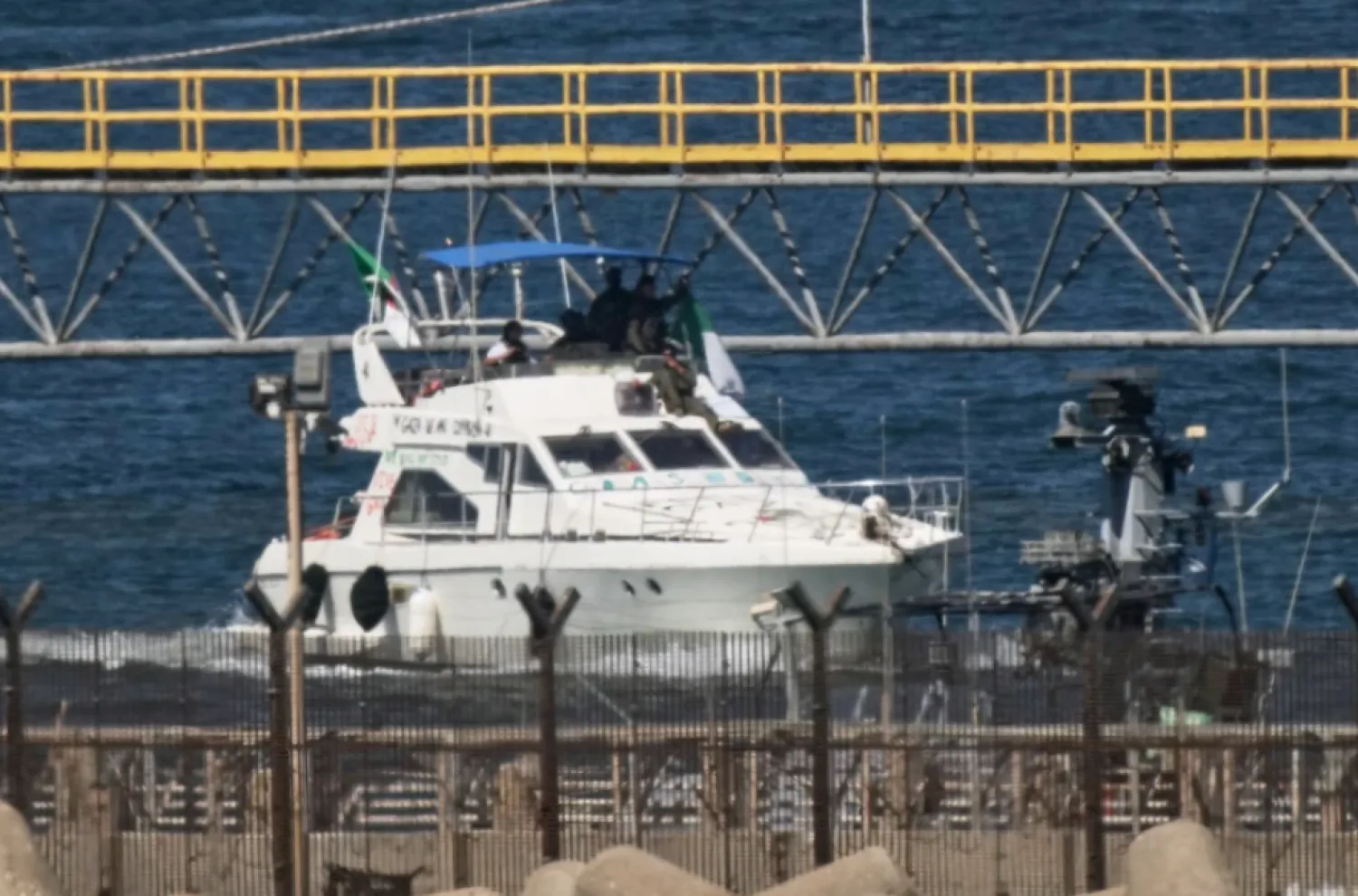 Israeli navy soldiers sail one of the Gaza-bound civilian flotilla Sumud’s boats into the port of Ashdod, Israel, Thursday, Oct. 2, 2025, after it was intercepted off the Gaza coast. (AP Photo/Leo Correa)

