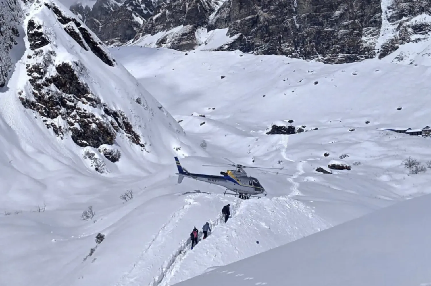 File photo of trekkers being rescued in a helicopter a day after an avalanche hit Mount Annapurna trail. (Phurba Ongel Sherpa/AP)