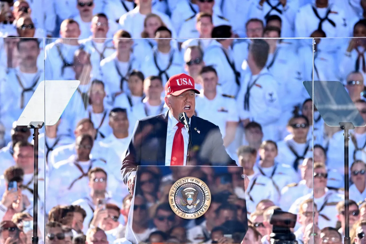 US President Donald Trump delivers remarks during the US Navy's 250th anniversary celebration, "America's Navy 250: Titans of the Sea - A Salute to the Fleet", at Naval Station Norfolk Pier 14 in Norfolk, Virginia on October 5, 2025. (AFP)