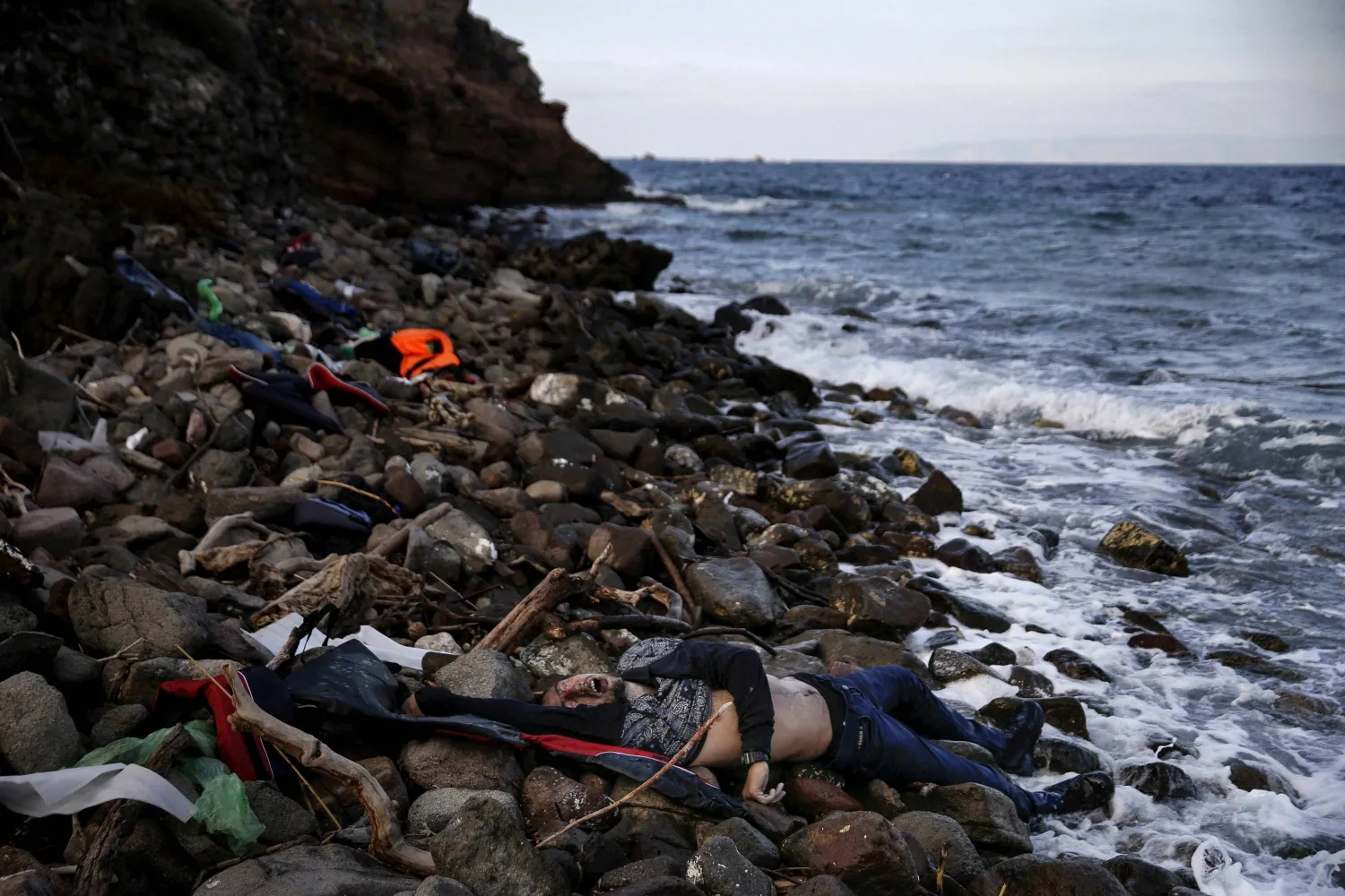 The body of an unidentified migrant is seen on a beach after being washed ashore, on the Greek island of Lesbos, November 7, 2015. Reuters and The New York Times shared the Pulitzer Prize for breaking news photography for images of the migrant crisis in Europe and the Middle East. REUTERS/Alkis Konstantinidis