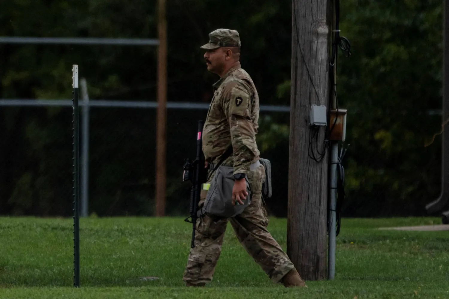 A Texas Army National Guard 36th Infantry Division soldier walks through the Joliet Army Reserve Training Center, after US President Donald Trump ordered increased federal law enforcement presence to assist in crime prevention, in Elwood, Illinois, US, October 7, 2025. REUTERS/Jim Vondruska