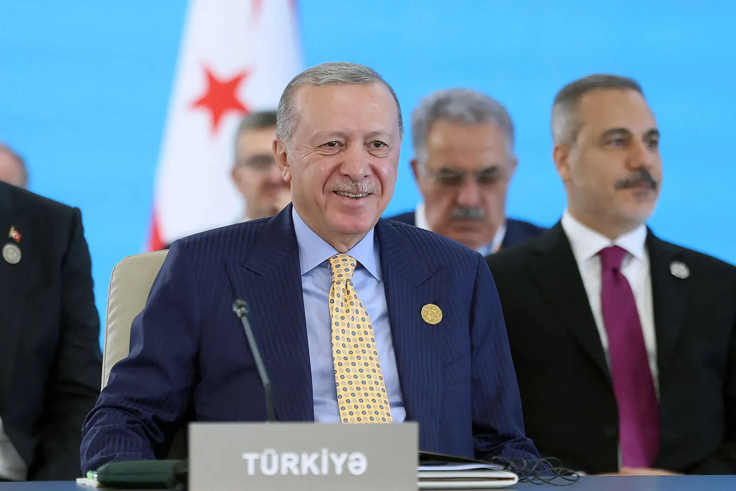 This handout photograph taken and released by Turkish Presidency Press Office on October 7, 2025, shows Türkiye's President Recep Tayyip Erdogan attending a session of the 12th Summit of the Organization of Turkic State (OTS) in Gabala, Azerbaijan. (Turkish Presidency Press Office / AFP) 
