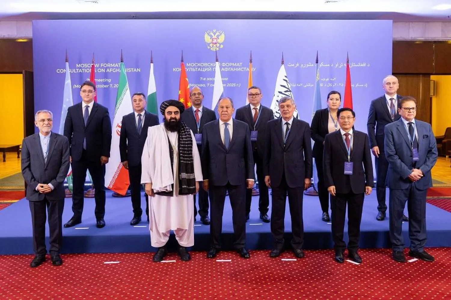 Participants of the 7th meeting of the Moscow Format of Consultations on Afghanistan, including Russia's Foreign Minister Sergei Lavrov and Afghanistan's Taliban acting Foreign Minister Amir Khan Muttaqi, pose for a picture in Moscow, Russia, October 7, 2025. (Russian Foreign Ministry/Handout via Reuters)