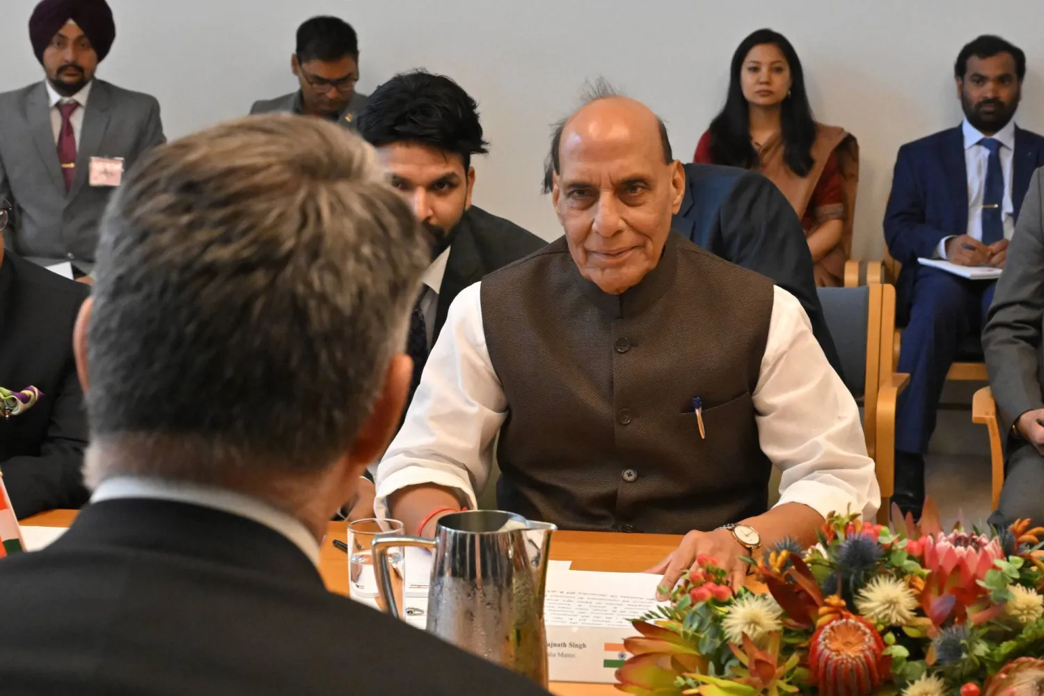 India's Defense Minister Rajnath Singh, right, sits with his Australian counterpart Richard Marles, back to camera, at Parliament House in Canberra, Australia, Thursday, Oct. 9, 2025. (Mick Tsikas/AAP Image via AP)