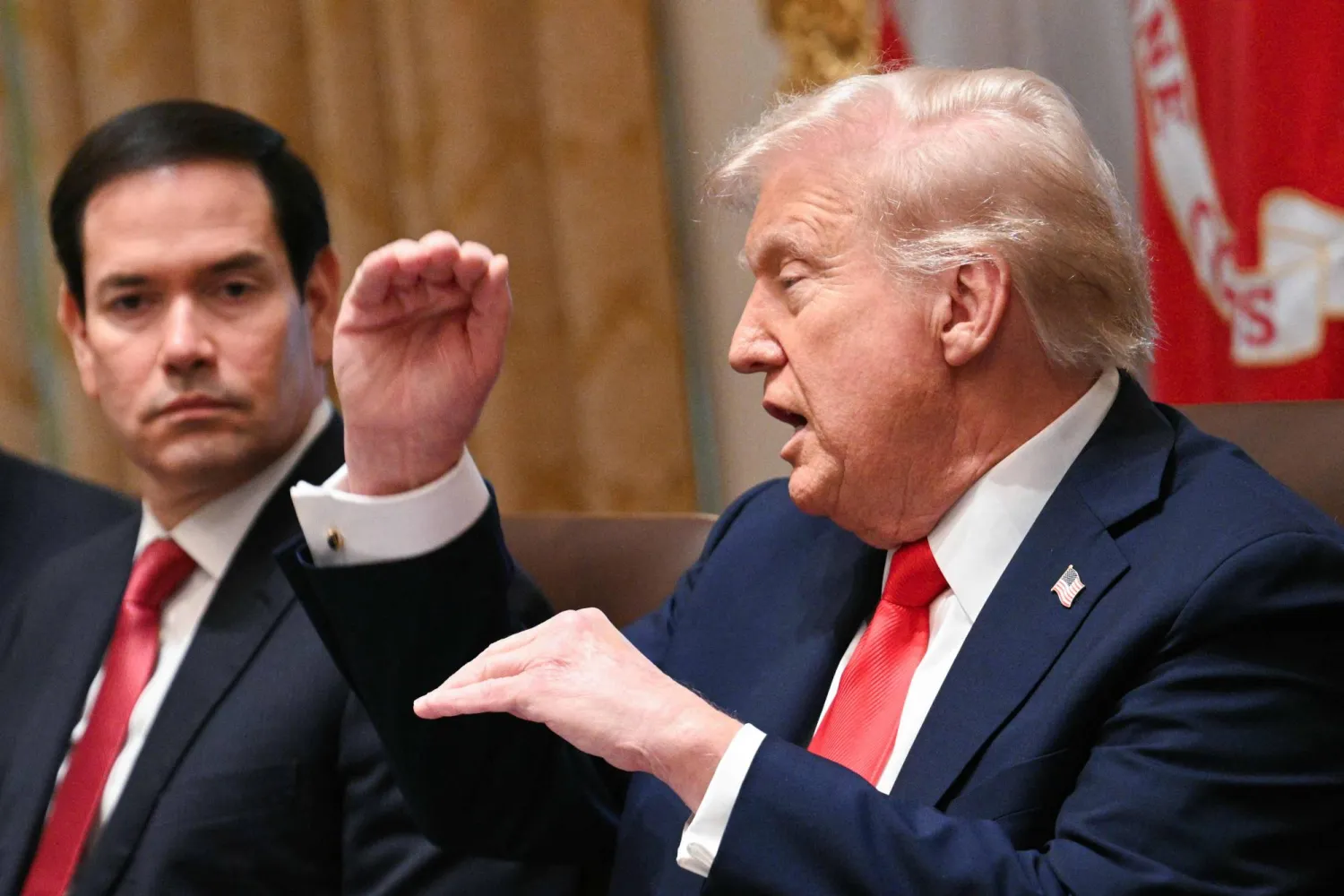 (L/R) Secretary of State Marco Rubio looks on as US President Donald Trump speaks during a cabinet meeting in the Cabinet Room of the White House in Washington, DC, on October 9, 2025. (Photo by Jim WATSON / AFP)