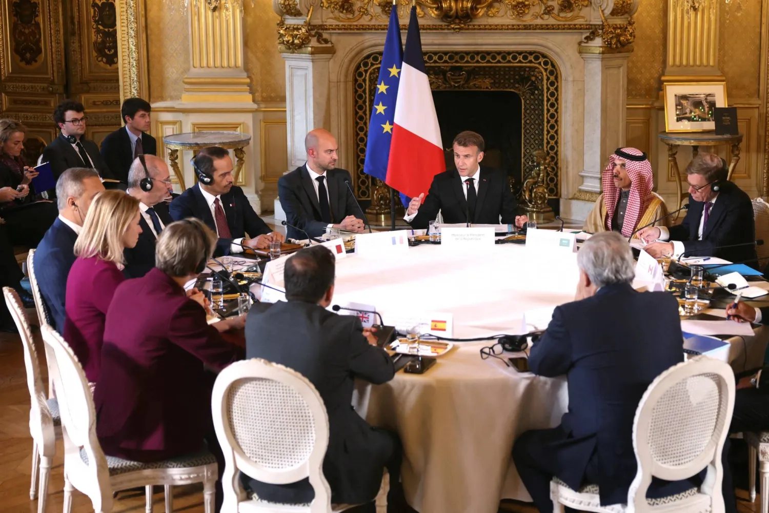 France's President Emmanuel Macron, next to the Minister for Europe and Foreign Affairs Jean-Noel Barrot and Saudi Foreign Minister Prince Faisal bin Farhan bin Abdullah, speaks during a ministerial meeting on the implementation of the Middle East peace plan at the Quai d'Orsay, in Paris, France October 9, 2025. (Thomas Samson/Pool via Reuters)