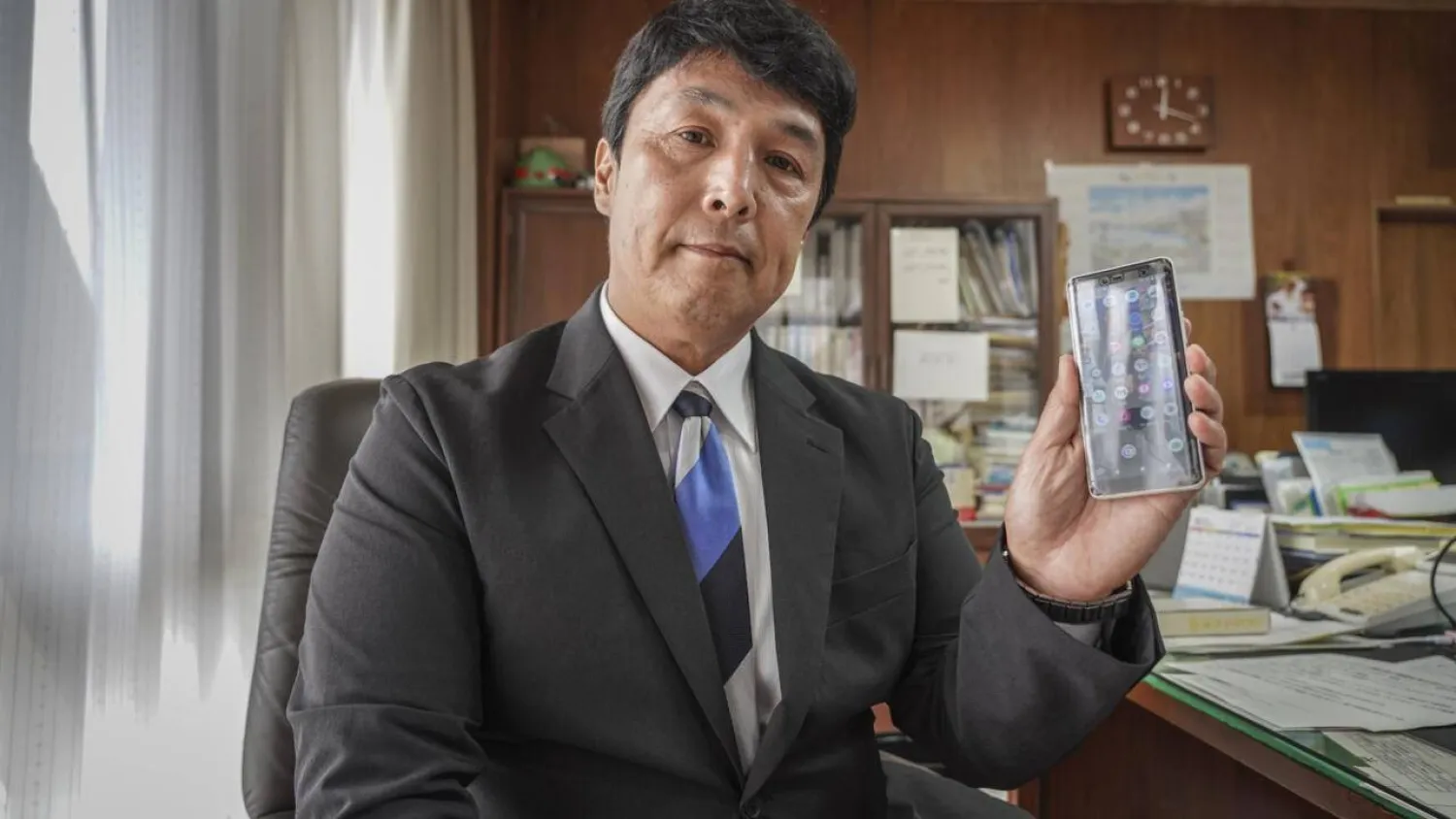 Mayor Masafumi Kouki says he worried for many months about the "negative effects of excessive smartphone use, especially the sharp decrease in direct human communication". Caroline GARDIN / AFP
