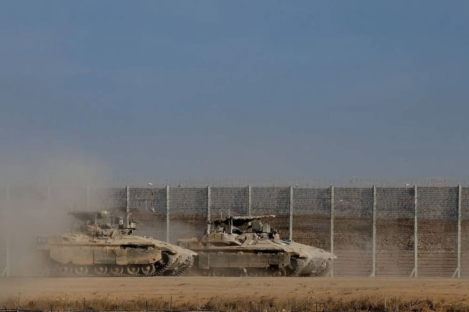 Israeli armored personnel carrier (APC) vehicles maneuver, after Israel's government ratified a ceasefire with Hamas in Gaza, on Israeli side of the Israel-Gaza border, in Israel, October 10, 2025. (Reuters)