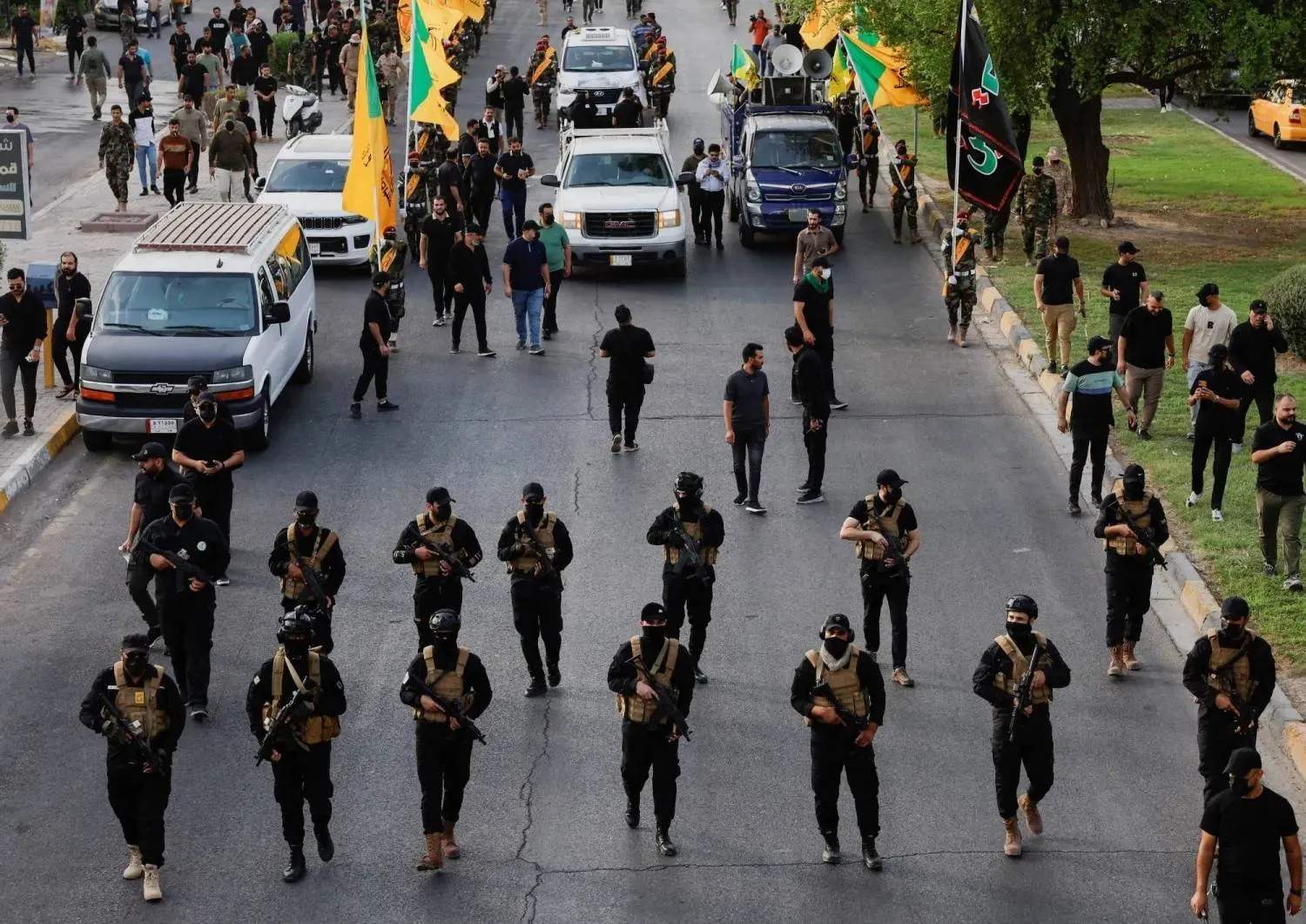 Kataib Hezbollah fighters during a parade in Baghdad, September 2024 (File/Reuters)