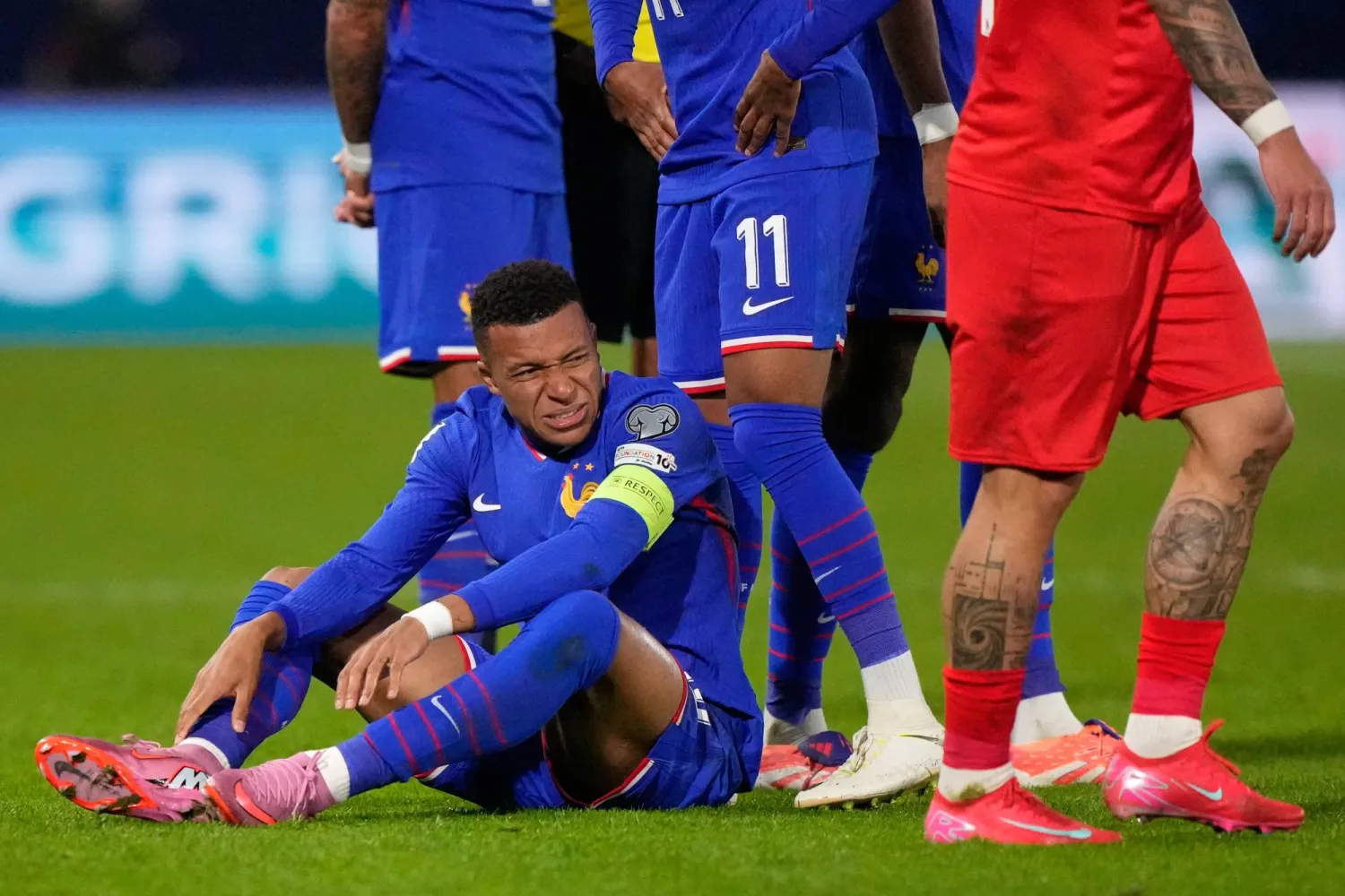 France's Kylian Mbappe grimaces during a World Cup 2026 Group D qualifying soccer match between France and Azerbaijan in Paris, France, on Friday, Oct. 10, 2025. (AP Photo/Michel Euler)