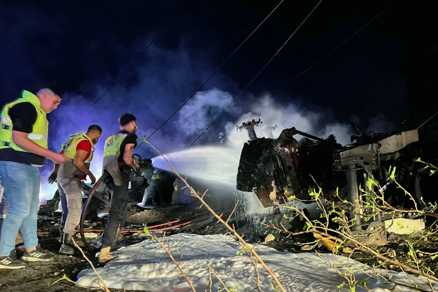 Firefighters douse the flames at the site of an overnight Israeli strike in al-Msayleh area in southern Lebanon on October 11, 2025. (Photo by Mahmoud ZAYYAT / AFP)