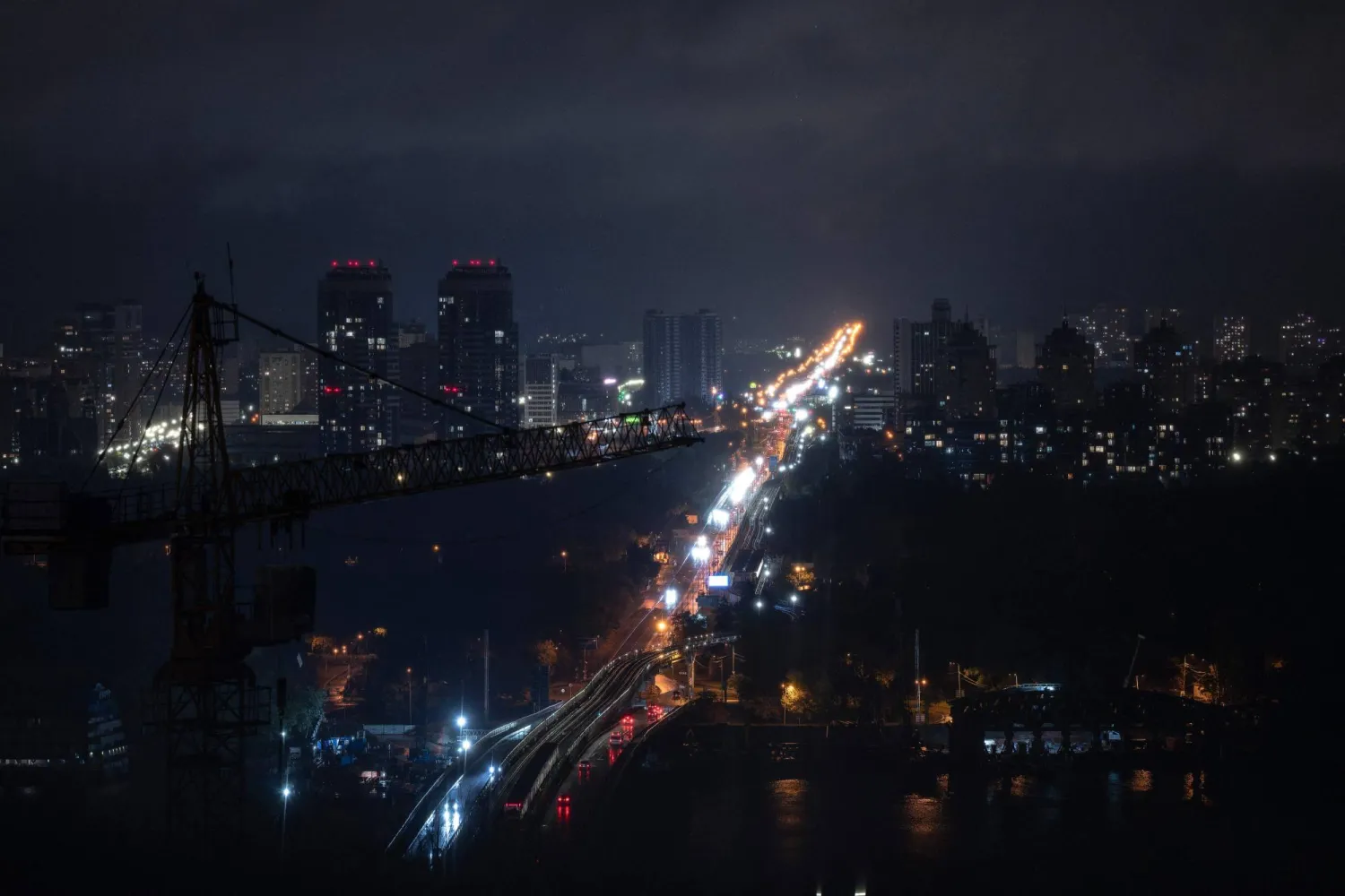 This photograph shows a general view of residential buildings during a power outage in Kyiv on October 10, 2025, following a Russian missiles and drones attacks amid the Russian invasion of Ukraine. (Photo by Andrew Kravchenko / AFP)