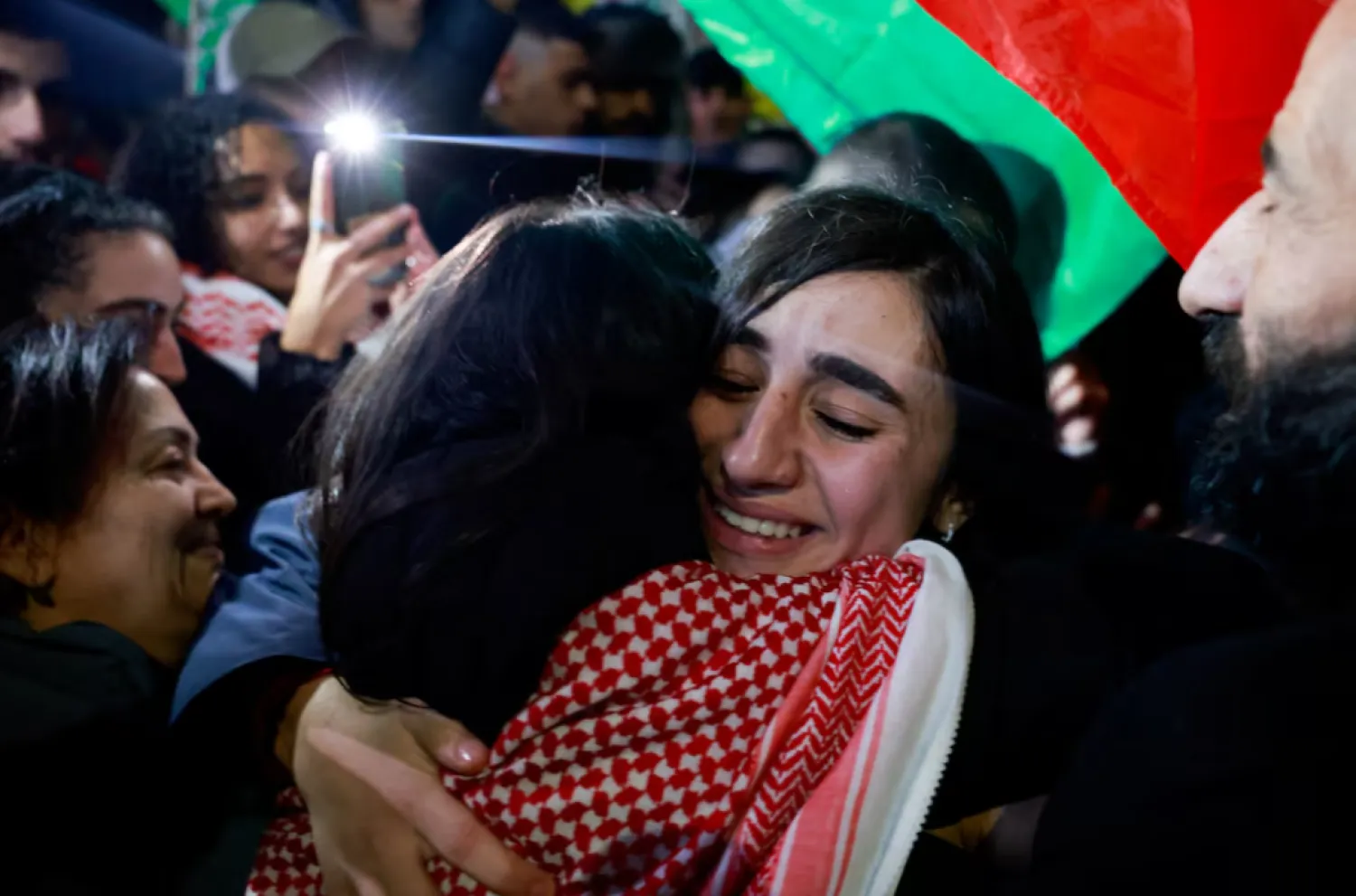 FILE:  People embrace after released Palestinian prisoners are released amid a hostages-prisoners swap deal between Hamas and Israel, in Ramallah in the Israeli-occupied West Bank, November 28. REUTERS/Ammar Awad 