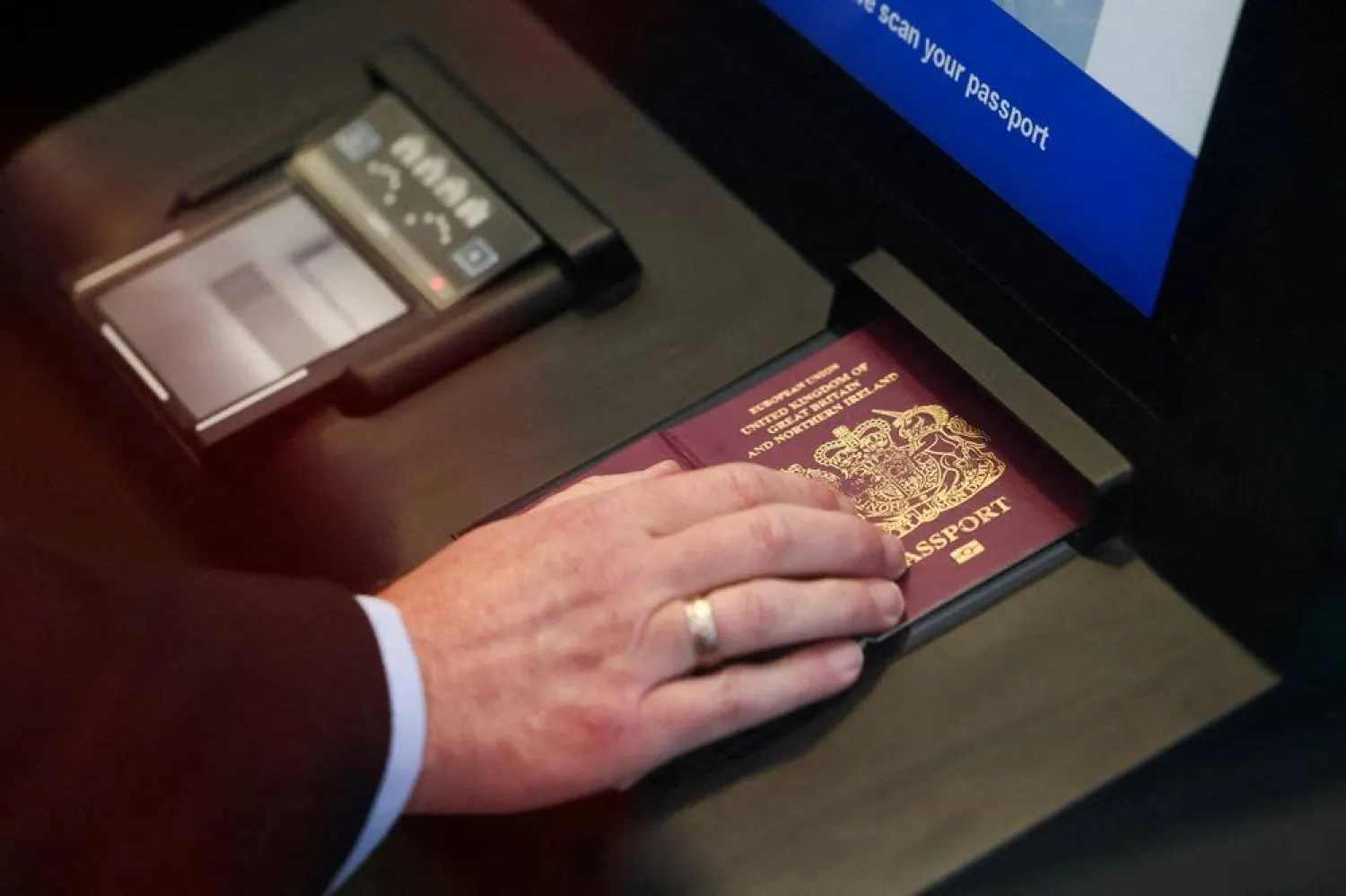 A man scans his passport during a demonstration of the European Union's Entry/Exit System (EES) at the Eurotunnel terminal in Folkestone, Britain, September 23, 2025. (Reuters)